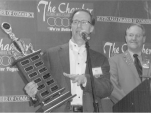 Bill Hickey accepts the Austin Chamber's "Business of the Year" award