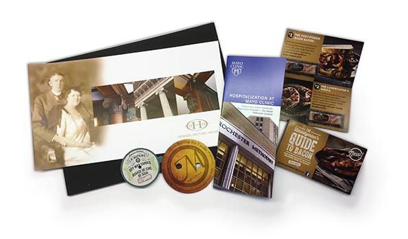 Unique business collateral samples, including special die cut items and drilling.